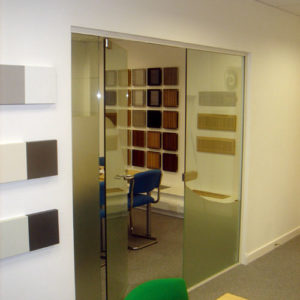 frameless glass partition with glass door in Ledbury