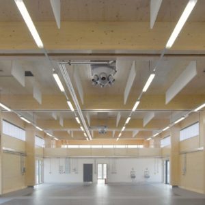 acoustic baffles hung from a roof space at high level to a school college hall in Herefordshire