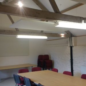 off white acoustic panels installed in a Herefordshire office. Rectangles hung from the ceiling, rectangles installed on the wall.