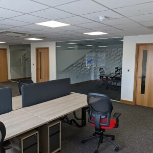 frameless glass partition with oak doors, oak door linings and oak skirting in Hereford